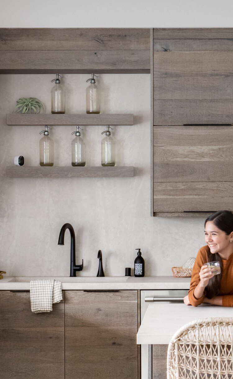 Arlo Pro 4 camera on ledge in living room.